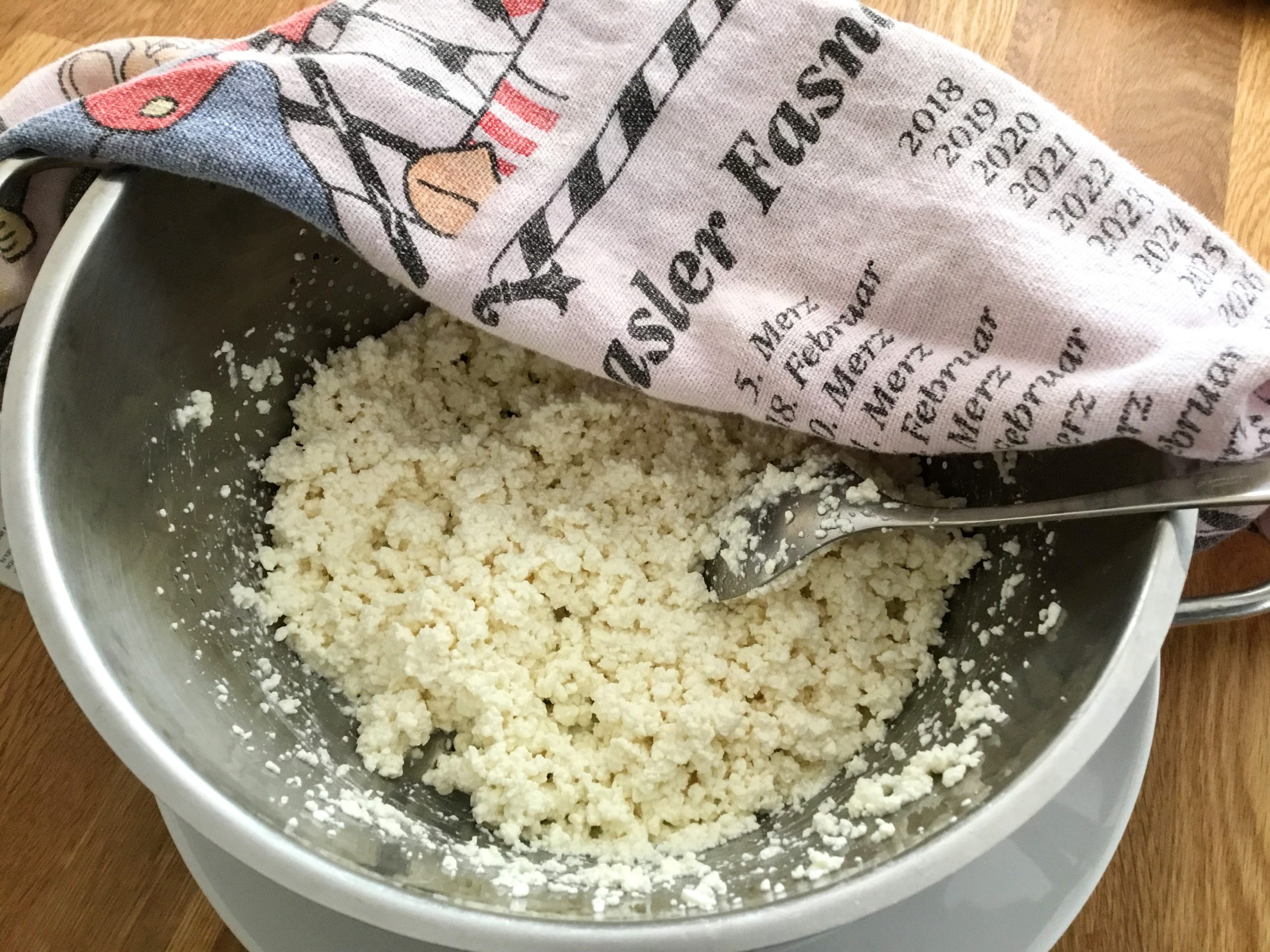 Curds after draining in a linen dishcloth
