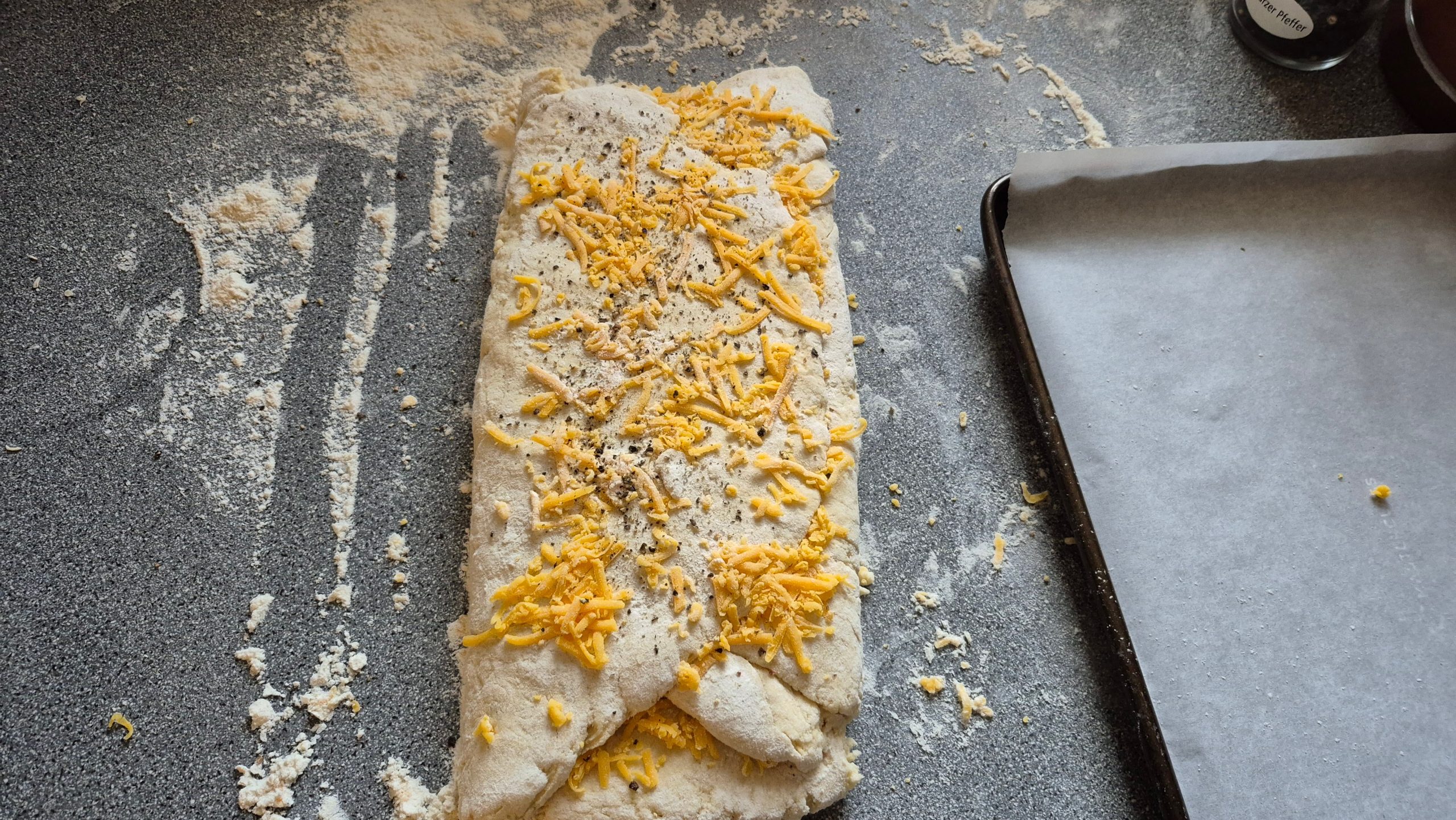 Folded scone dough with more cheese on top