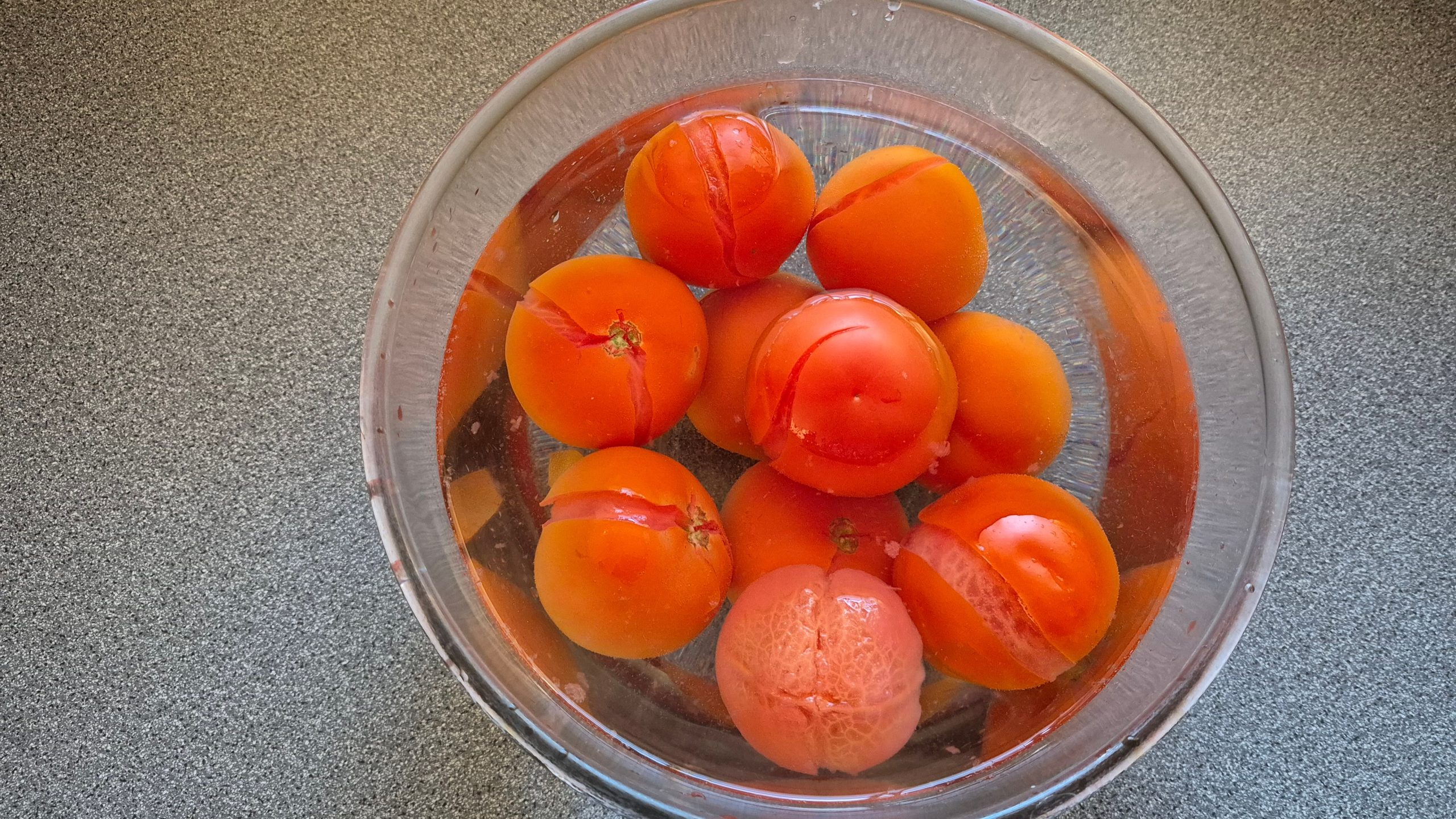 Blanched and cold-water-bathed fresh tomatoes