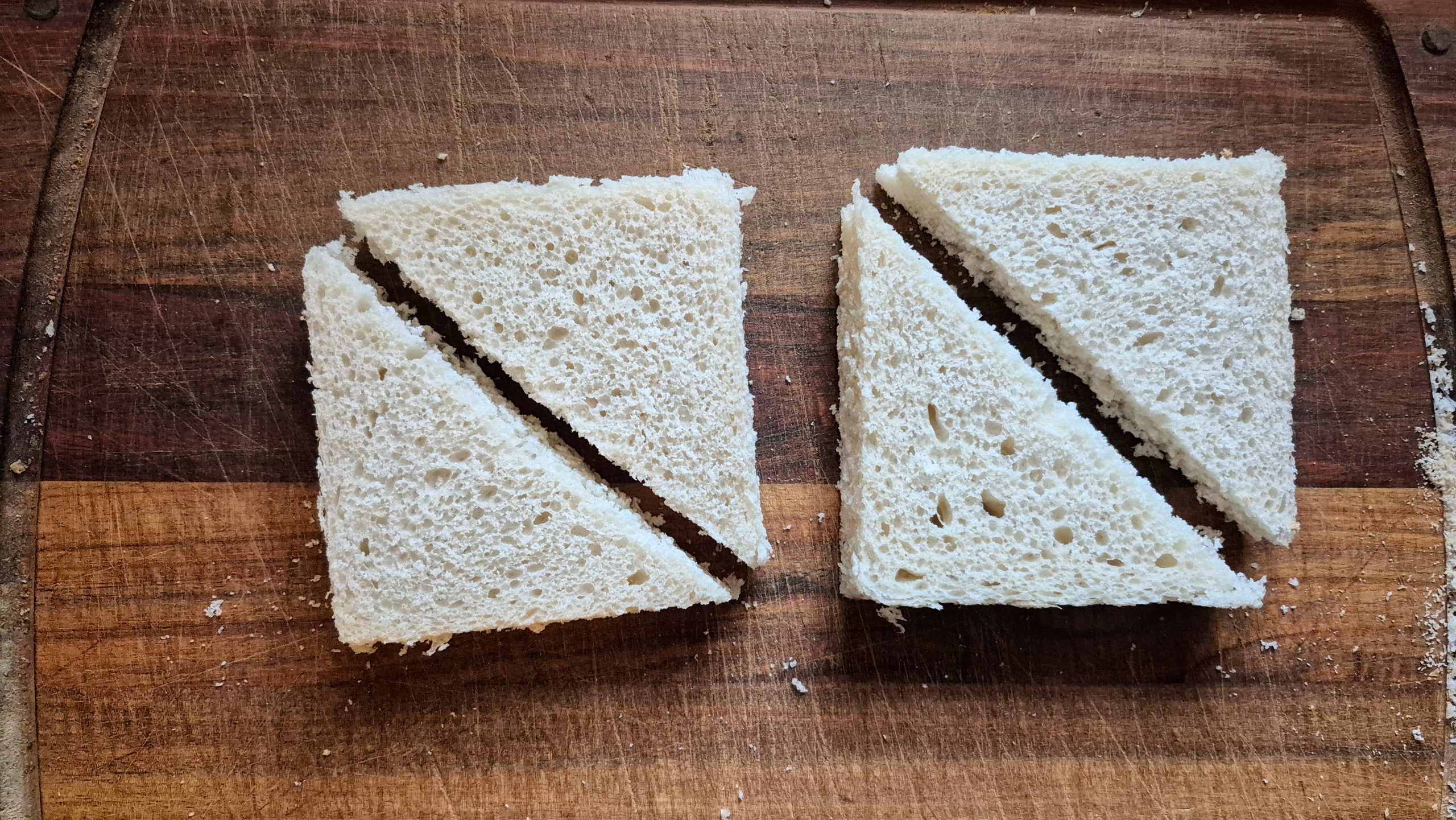 The bread slices cut diagonally, into triangles
